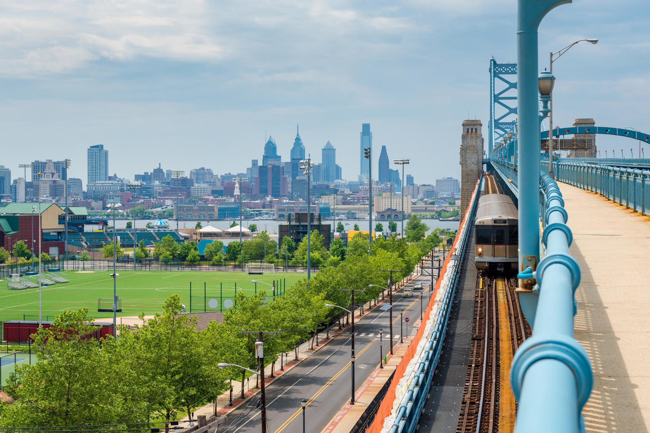 Photo of bridge and train from Camden County of Philadelphia skyline