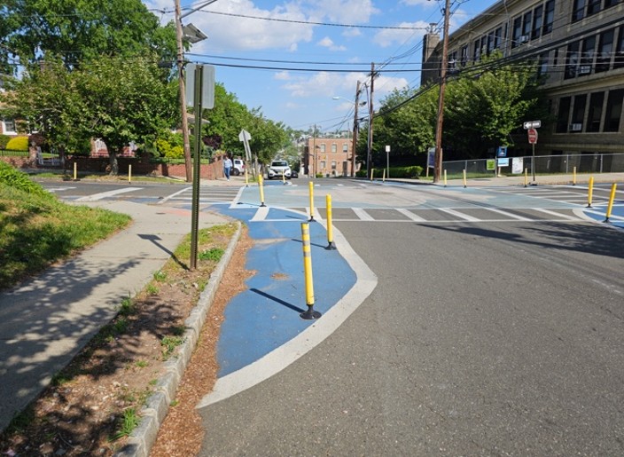 Temporary curb extensions in Belleville, NJ. The flex-posts reduce vehicle speeds and reduce the crossing distance for pedestrians. (Source: NJDOT Bicycle & Pedestrian Resource Center)